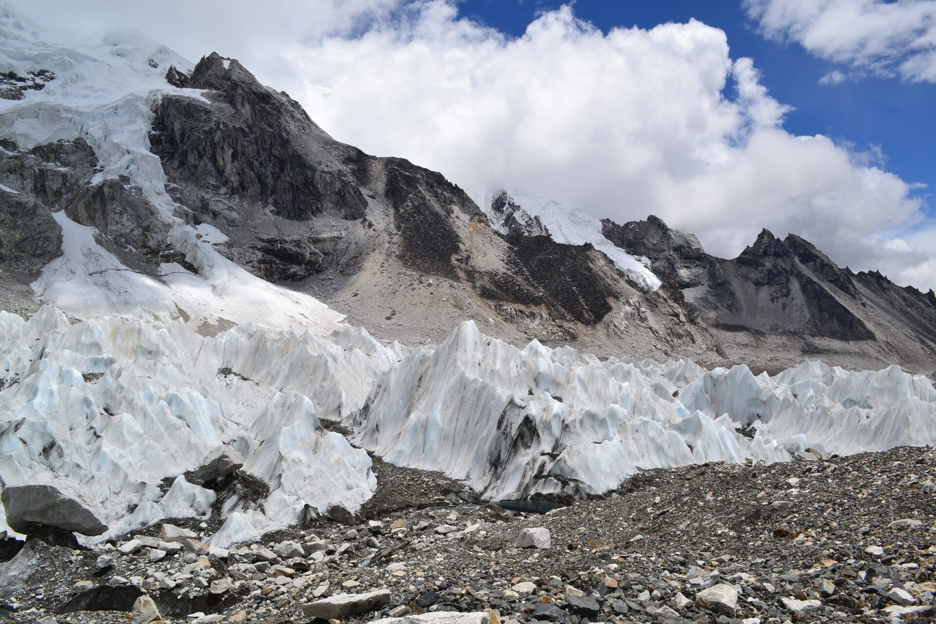 Glacier ice pinnacles beneath a rock face in the Everest region of Nepal — the pressure and structure underneath a data-ready enterprise