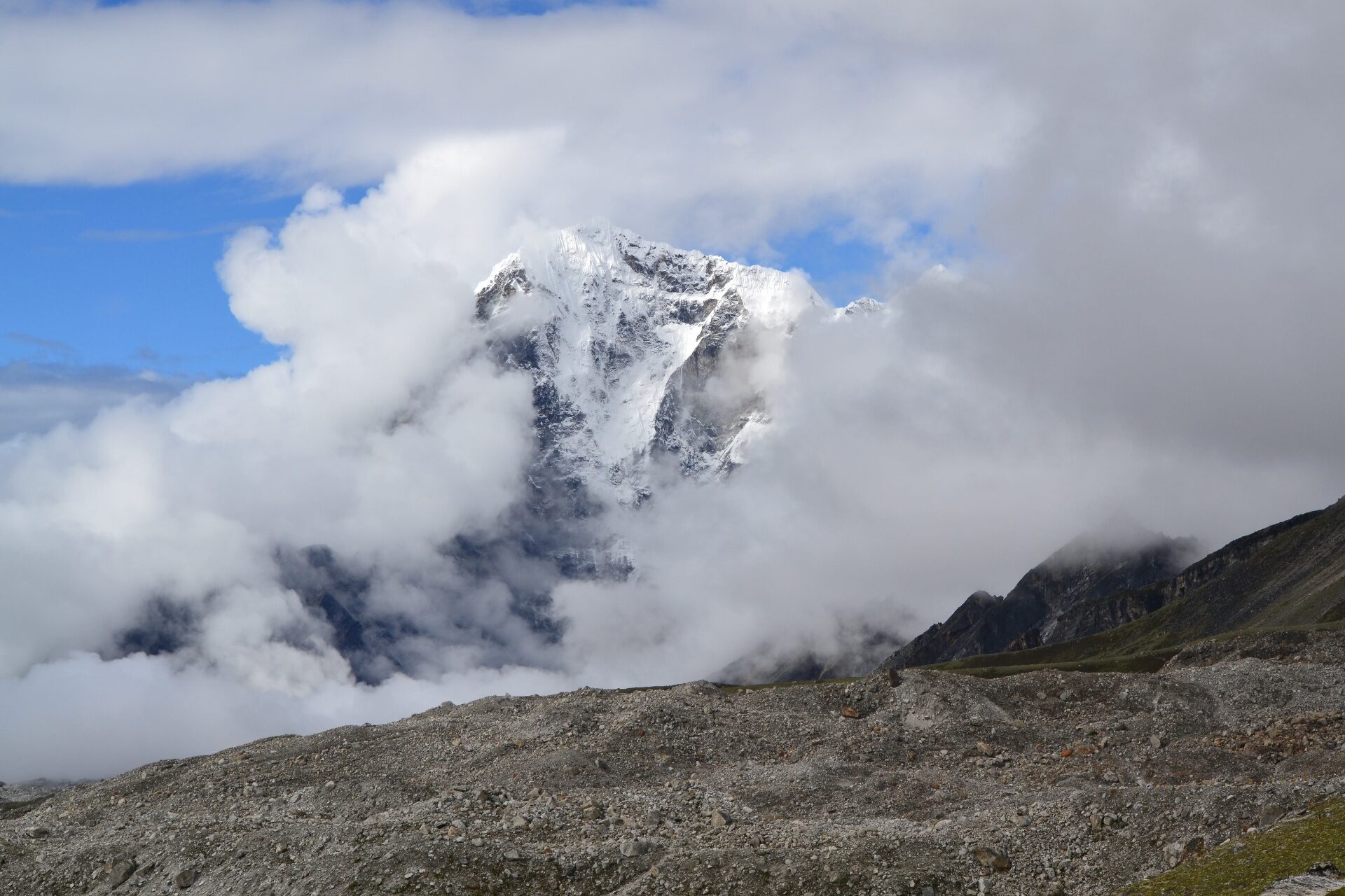 A Himalayan summit emerging from cloud in the Everest region of Nepal — the clarity that comes when forecast discipline holds